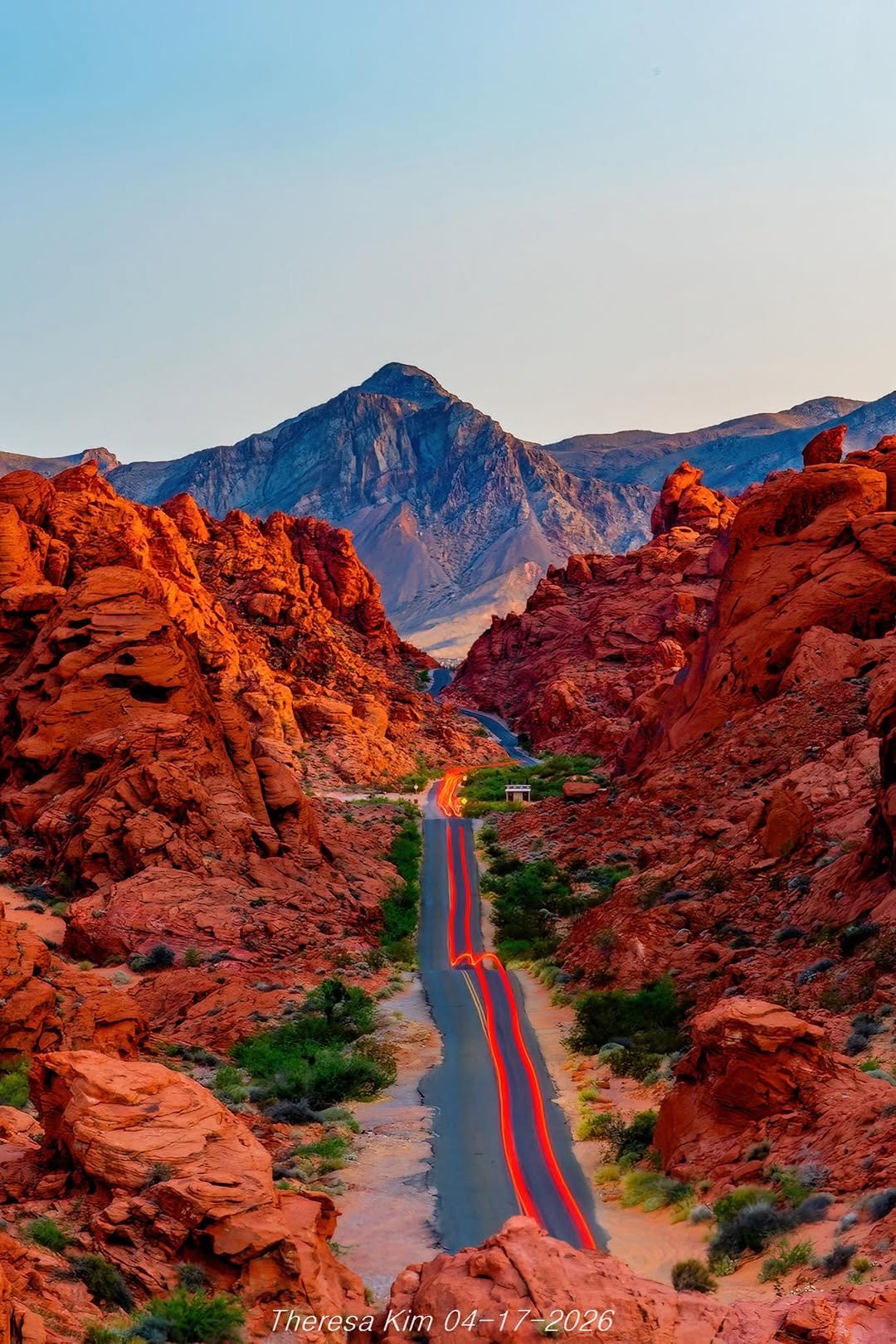 River winding through a red rock canyon toward a mountain peak